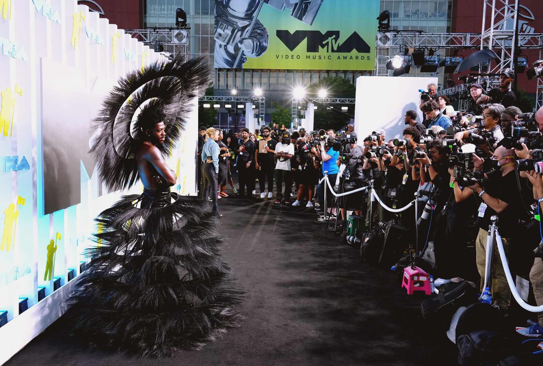 Lil Nas X was a strong contender for best dressed, wearing a sculptural Harris Reed ensemble featuring a tiered feathered skirt frame and headdress.
