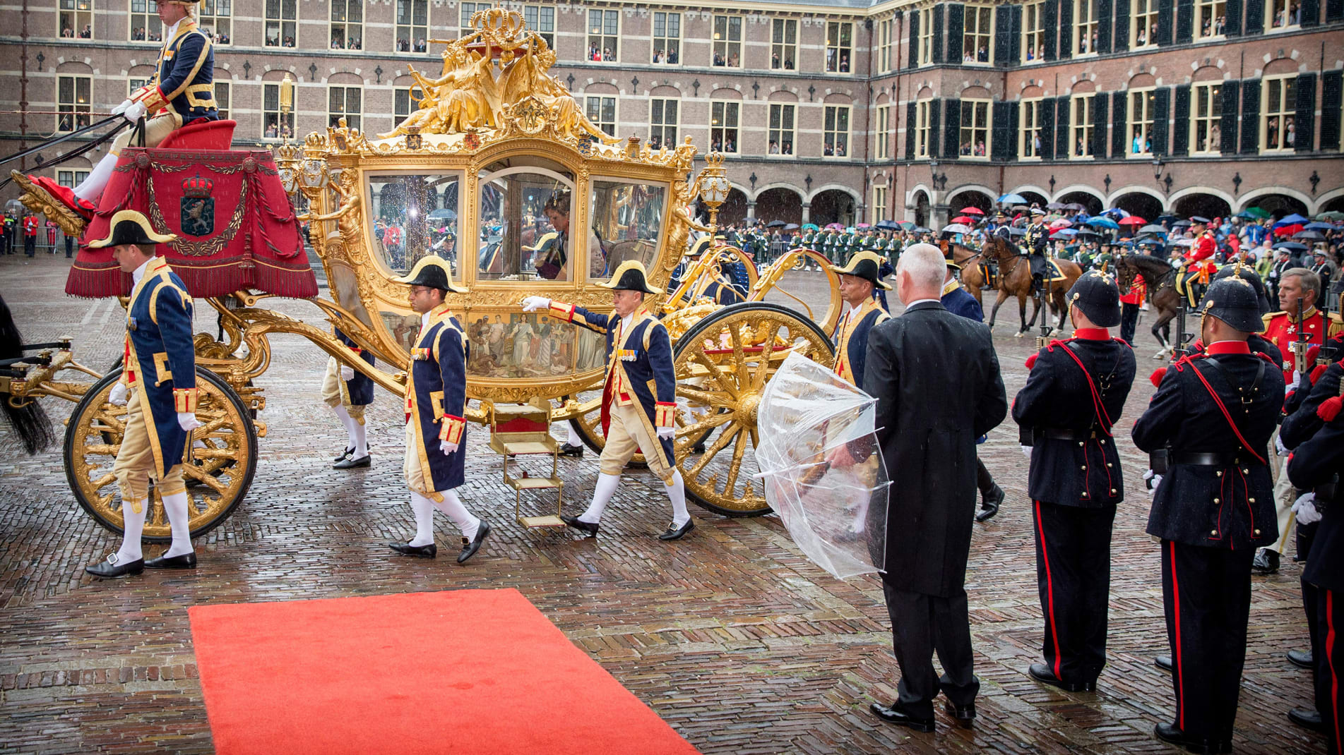 King Willem-Alexander and Queen Maxima arrive in the Golden Coach at the Ridderzaal in The Hague in September 15, 2015. 