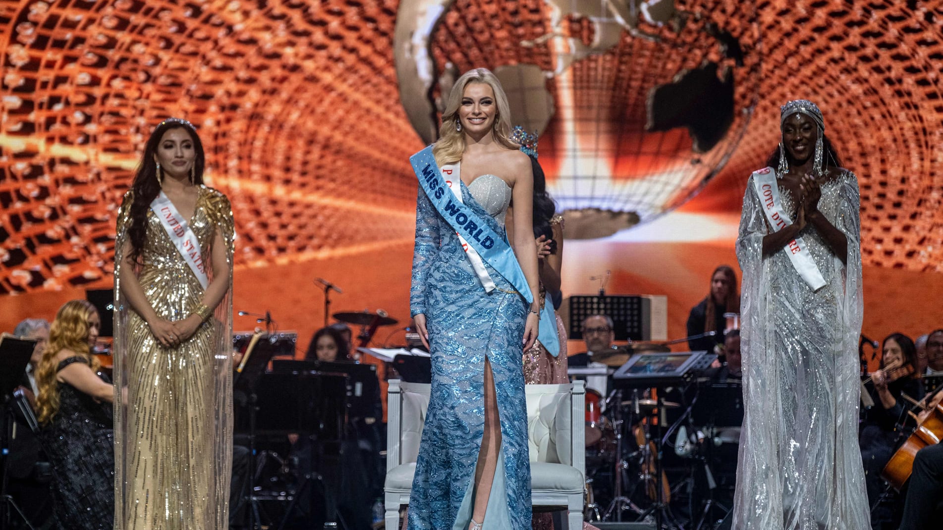Miss Poland Karolina Bielawska (C) smiles after winning the 70th Miss World beauty pageant at the Coca-Cola Music Hall in San Juan, Puerto Rico on March 16, 2022. 