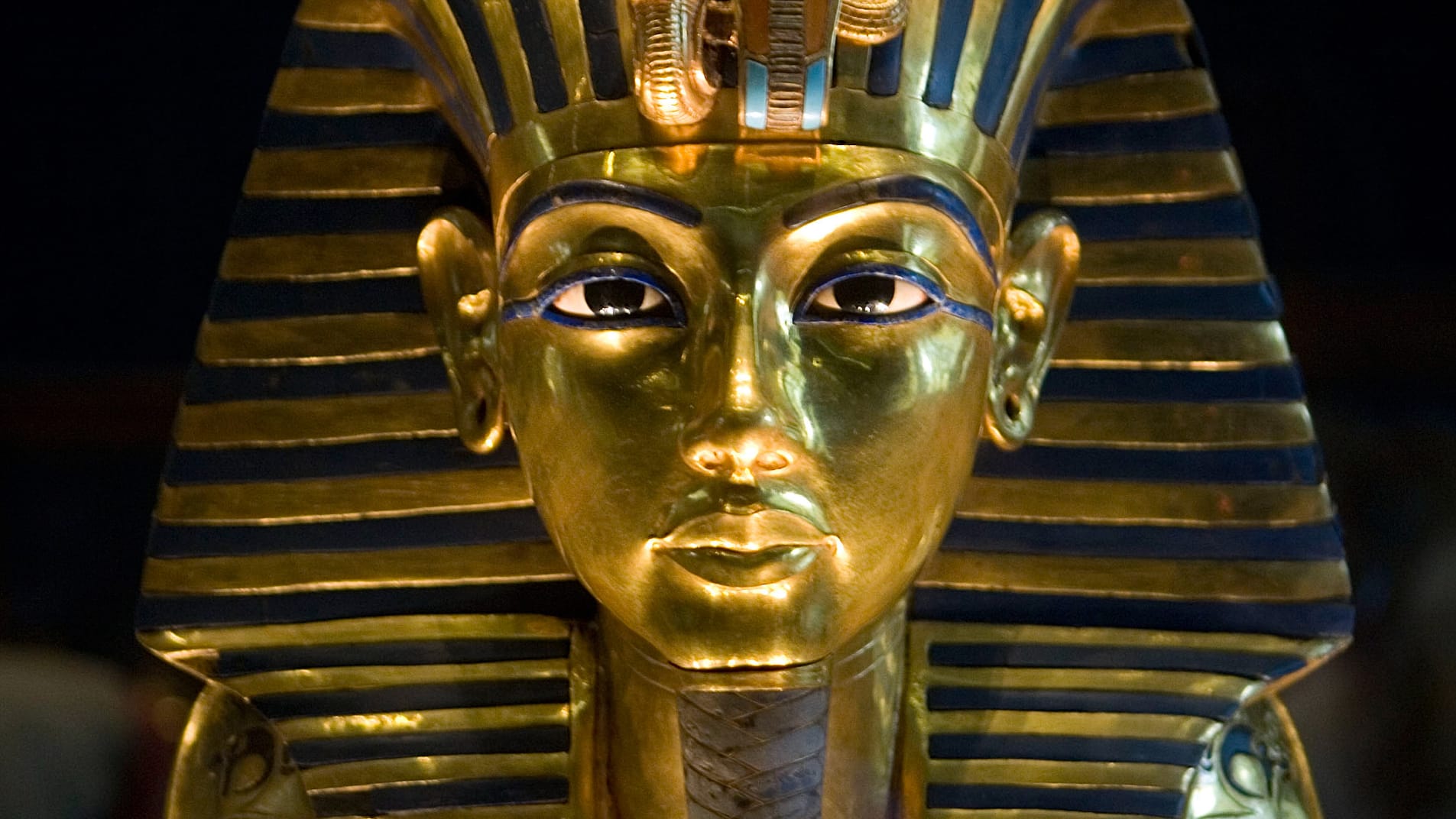 (FILES) -- A picture taken on October 20, 2009 shows King          Tutankhamun's golden mask displayed at the Egyptian museum in          Cairo. DNA testing has unraveled some of the mystery surrounding          the birth and death of pharaoh king Tutenkhamun, revealing his          father was a famed monotheistic king and ruling out Nefertiti as          his mother, Egypt's antiquities chief said on February 17, 2010.          AFP PHOTO/KHALED DESOUKI (Photo credit should read KHALED          DESOUKI/AFP/Getty Images)