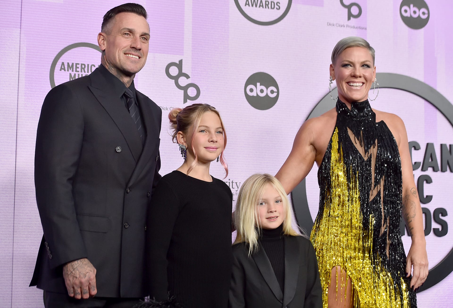 Pink, right, arrived in a fringed Bob Mackie dress alongside husband Carey Hart and their children Willow and Jameson. 