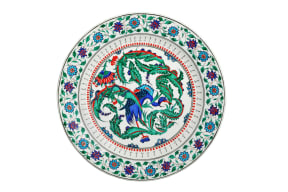 A contemporary interpretation of "Iznik" tilework by Turkish ceramics artist Mehmet Gursoy, who nods to the tradition of his craft through Chinese motifs like cranes and lotus flowers.
