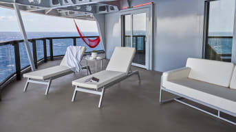 Suits feature private sun loungers and an outdoor terrace couch.