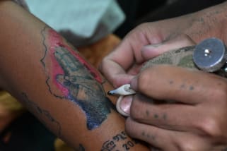 Myanmar Protesters Getting Permanent Symbols Of Resistance Tattoos Cnn Style