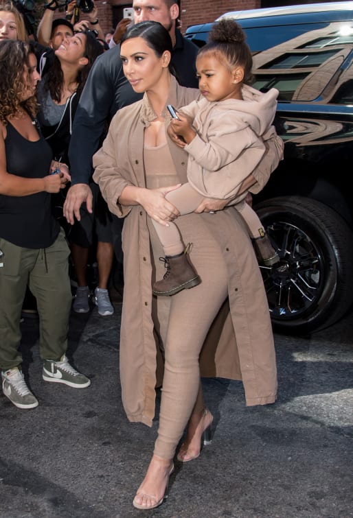 Kim Kardashian West and her daughter North at a Yeezy showcase for New York Fashion Week in 2015.