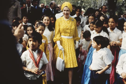 Queen Elizabeth II with a group of children during her state visit to Mexico in 1975.
