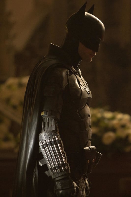 The new batsuit is gray instead of black, with a small yellow detail on the sleeve.