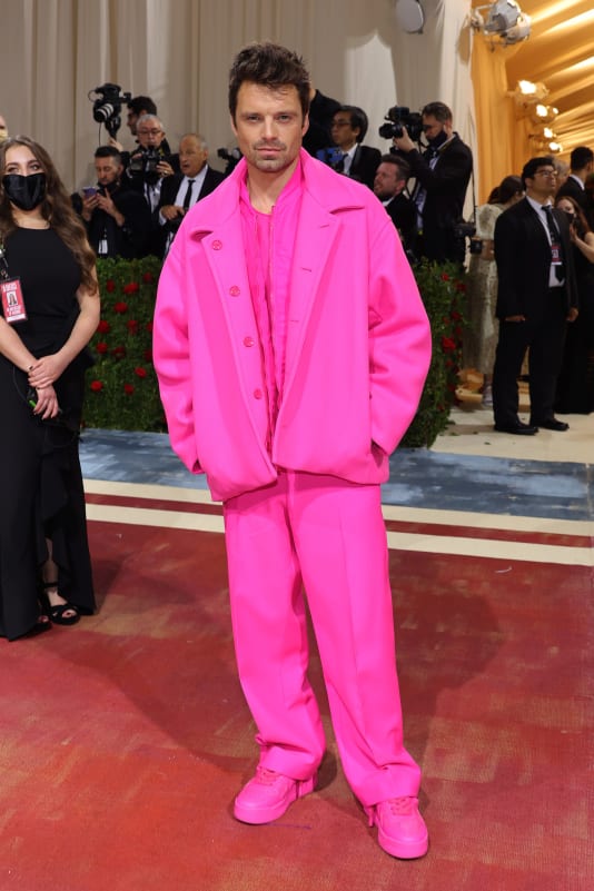 Marvel star Sebastian Stan could be seen a mile away from the Met Gala's red carpet, choosing a neon pink Valentino look.