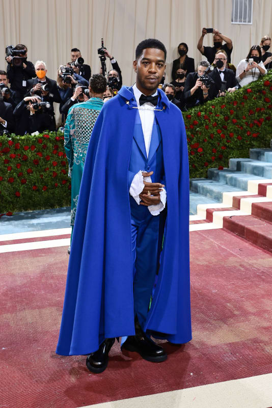 Musician Kid Cudi became the first celebrity to wear a custom look by Kenzo's newest creative director Nigo, donning a blue suit and matching cape for the gala. 