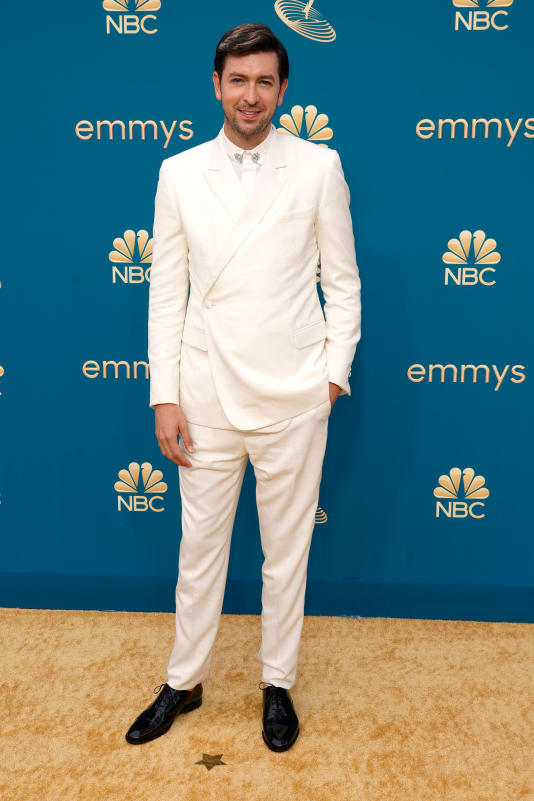 Nicholas Braun in an all-white suit with a sparkling collar detail by Dior Men.
