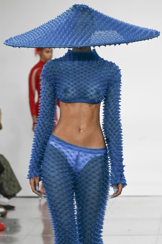 The sculptural spikes also adorned Lo's accessories, from hats to bags to belts to full face masks.
