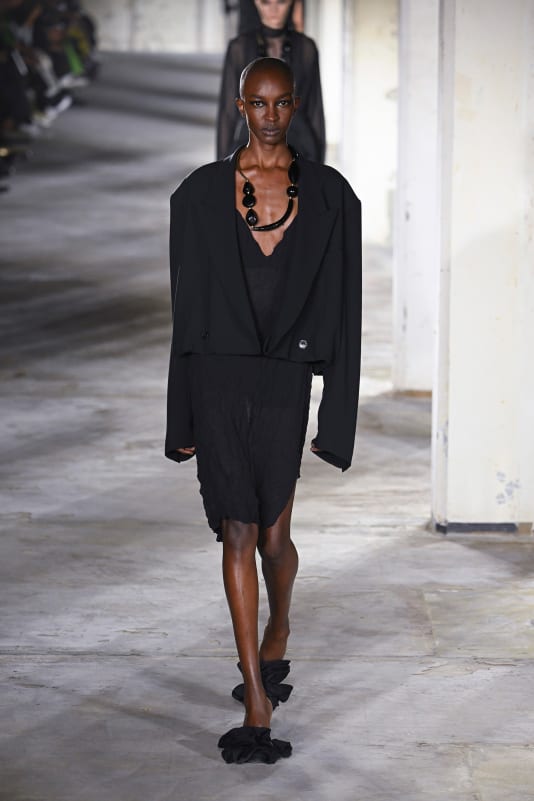 The Dries Van Noten show began with models wearing all-black ensembles.