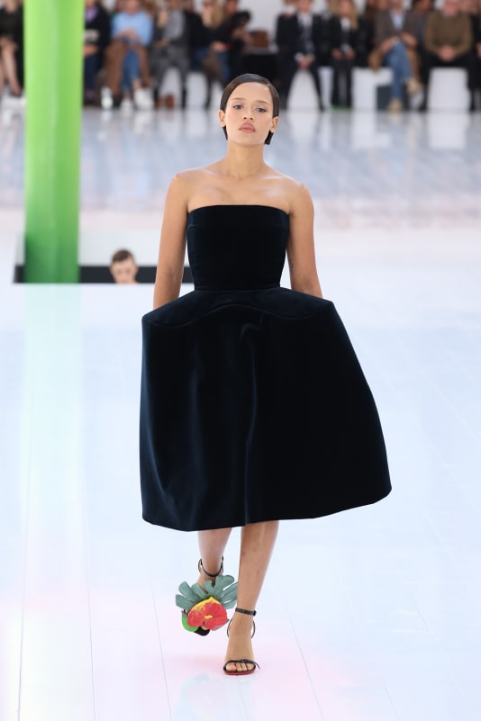 The silhouette of a strapless dress and boxy, voluminous skirt repeated throughout the collection.