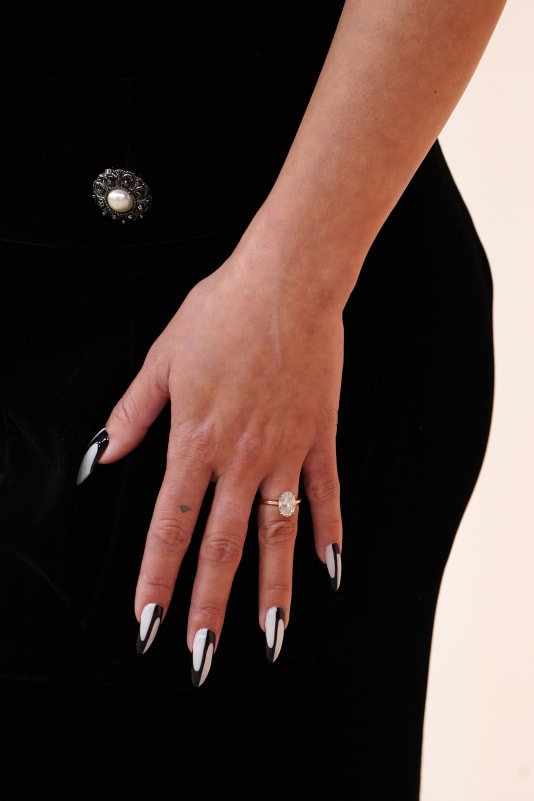 Vanessa Hudgens completed her look with matching black and white nail art.