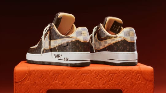 The sneakers are made from calf leather, featuring the Louis Vuitton monogram and pattern alongside the Nike swoosh. The quotation marks on the design are Abloh's "signature" design, Sotheby's said.