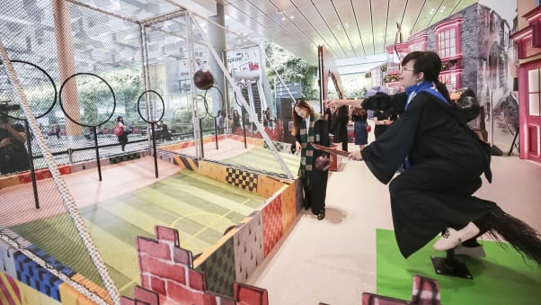 Fans balance on a broomstick while attempting this activity based on the wizarding sport Quidditch. Image: Changi Airport Group