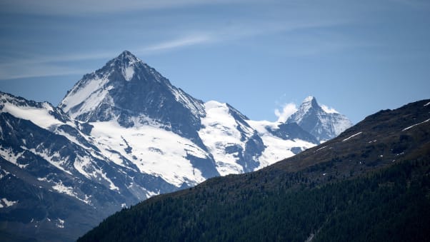 Mountainous Switzerland always provides a cool spot somwhere. Dent Blanche, left, is next to the Matterhorn in the Swiss Alps. 