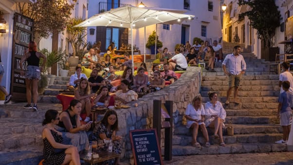 Tourists gather in the Old Town of Ibiza on August 6, 2021.
