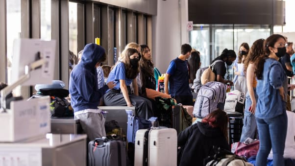 Travelers wait at Newark Liberty International Airport on July 1, 2022. The airport was plagued with cancellations and delays this summer.