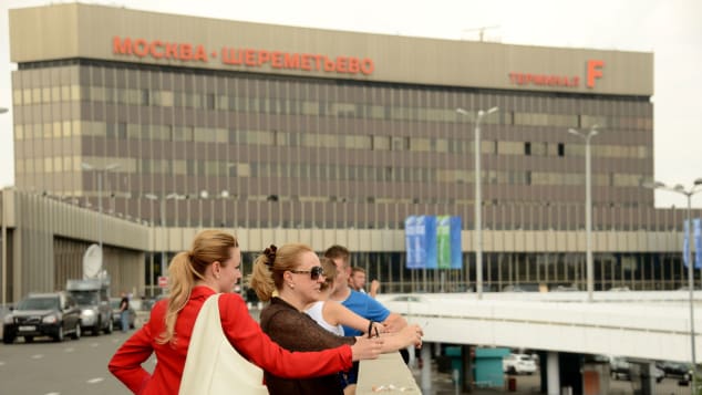 People stand in front of Sheremetyevo airport terminal F in Moscow on June 26, 2013 where US intelligence leaker Edward Snowden on June 26, 2013 spent a fourth day with his onward travel plans still a mystery as Ecuador warned it could take months to consider his asylum request. The man responsible for one of the biggest intelligence security breaches in US history has not been sighted since arriving in Moscow on a flight on June 23 from Hong Kong and according to Russia is still in a transit zone at Sheremetyevo airport. AFP PHOTO / KIRILL KUDRYAVTSEV (Photo credit should read KIRILL KUDRYAVTSEV/AFP/Getty Images)