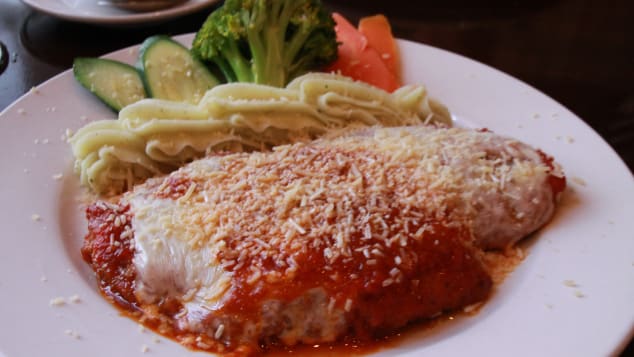 Australians have put their own stamp on chicken parmigiana. 