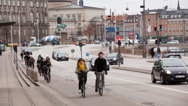 Ride a bike with your romantic partner in Copenhagen, Denmark.
