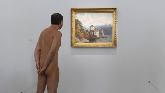 Nudists check out the "Discorde, Fille de la Nuit" exhibition at the Palais de Tokyo museum in Paris.