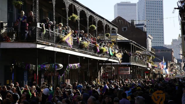 Following a long tradition, revelers pack Bourbon Street during Mardi Gras day back in 2016.