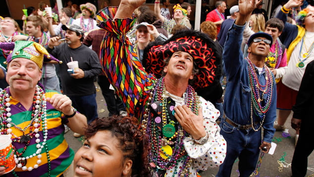 A group of people shout for beads on Bourbon Street on Mardi Gras day back in 2007. The celebration took on even more meaning for New Orleans after Hurricane Katrina.