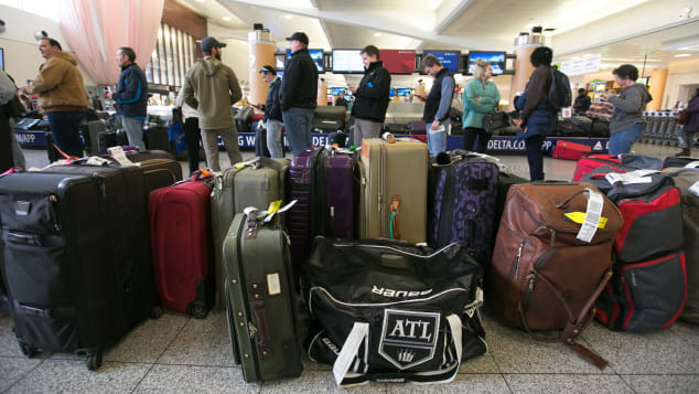 Passengers search for their luggage at Hartsfield-Jackson Atlanta International Airport.