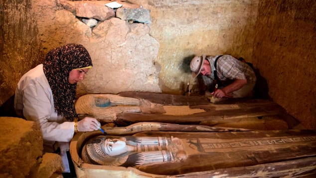Excavation workers inside the tomb