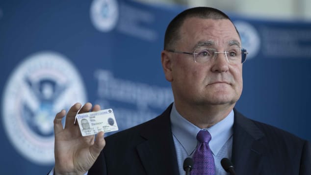 Todd Hauptli, CEO of the American Association of Airport Executives, shows his REAL ID-compliant driver's license during a news conference at Ronald Reagan Washington National Airport on October 1, 2019. 