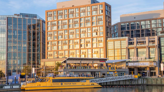 The Wharf riverfront development project is attracting dining, hotels and visitors. Shutterstock