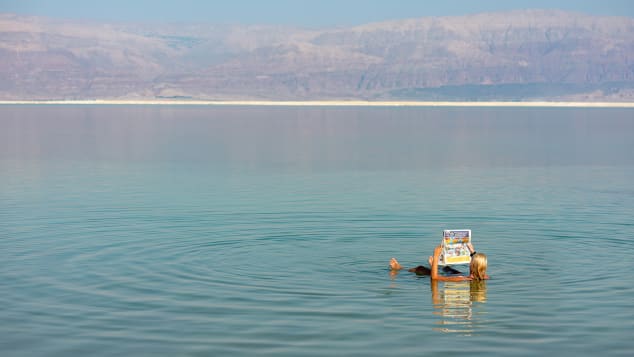 Float your worries away. The Dead Sea is the perfect spot to relax during a tour of the Middle East. Shutterstock