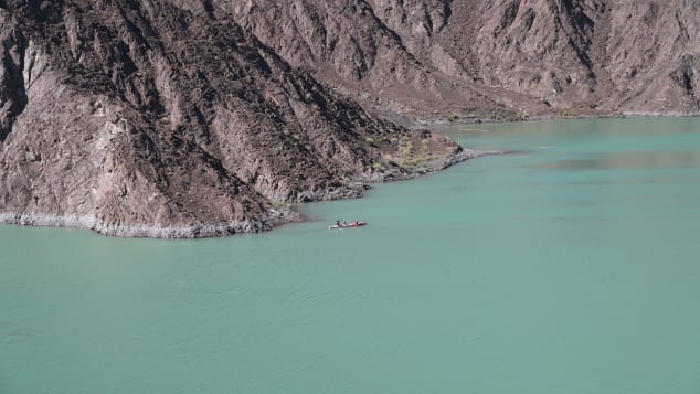 Visitors row a kayak in Hatta reservoir, one of the reserve's few bodies of water. 