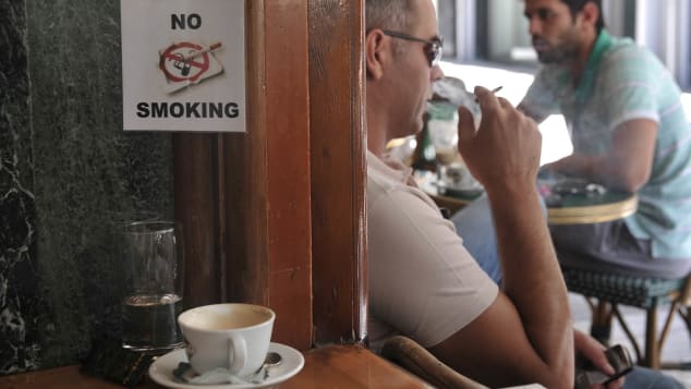 Fresh food, stale air -- al fresco cafes are still frequented by smokers.