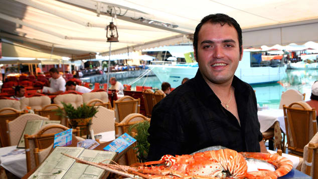 Greece will still be offering warm welcomes... and delicious seafood... when the crisis is over. 