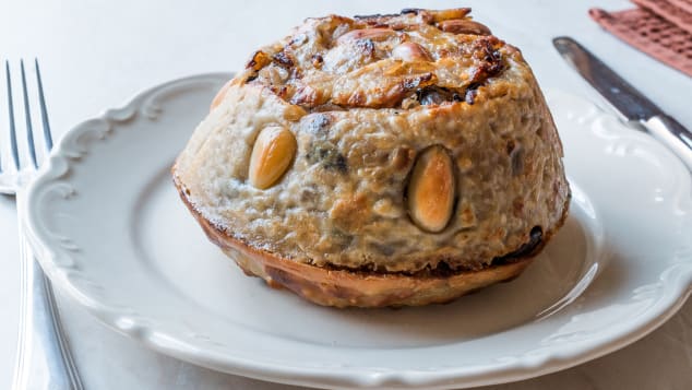 Perde pilav -- a buttery dough filled with rice, chicken, currants, almonds, pine nuts and butter