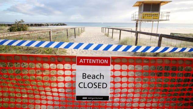 The beaches are closed and travelers and international arrivals into Australia are being sent to mandatory quarantine in hotels for 14 days. 
