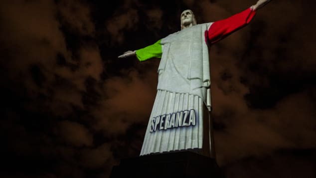 The flag of Italy, which has been severely affected by the coronavirus pandemic, was projected onto the monument.
