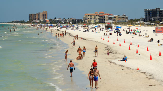 People visit Clearwater Beach after Governor Ron DeSantis opened the beaches at 7am on May 4 Clearwater, Florida.