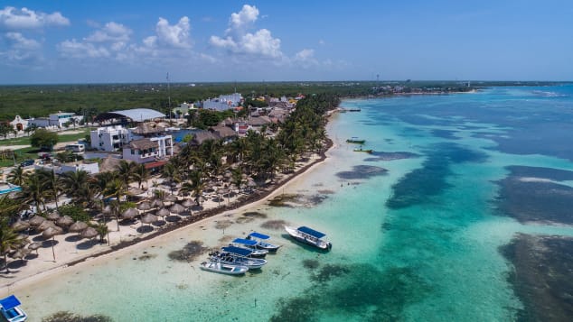 An empty beach in Mahahual, Quintana Roo, Mexico, may soon be filled with social distanced beachgoers.
