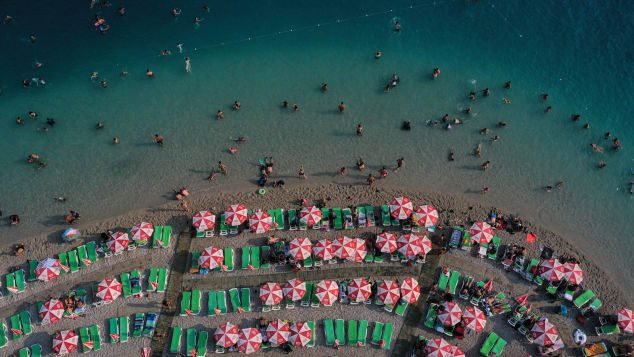 People enjoy the beach on August 16, 2019 in Oludeniz, Turkey.