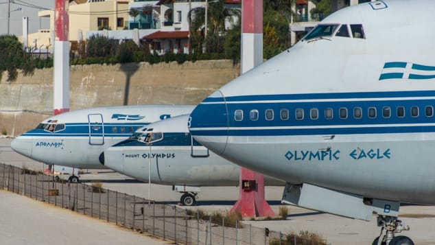 The airport still contains abandoned airplanes belonging to defunct carrier Olympic Airways.