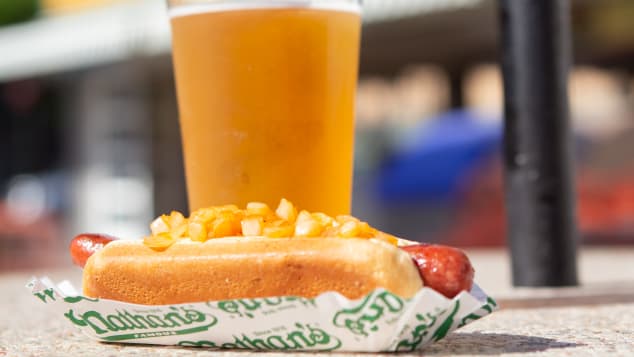 A visit to Coney Island in the summer nearly always involves hot dogs, and, frequently, beer.