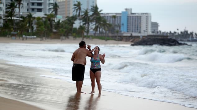 Tourists on the beach in Old San Juan, Puerto Rico, before the coronavirus pandemic.  