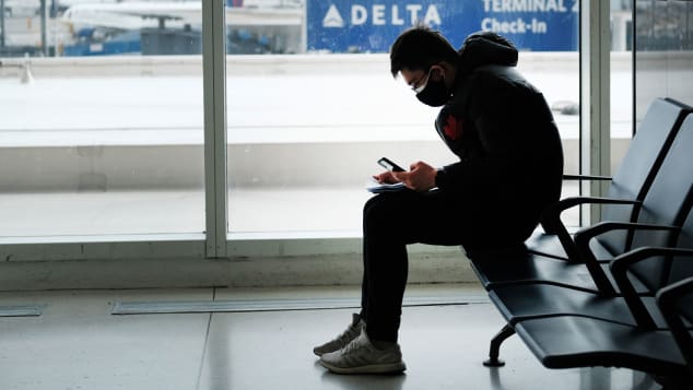 A passenger in the terminal at John F. Kennedy Airport on January 31, 2020 