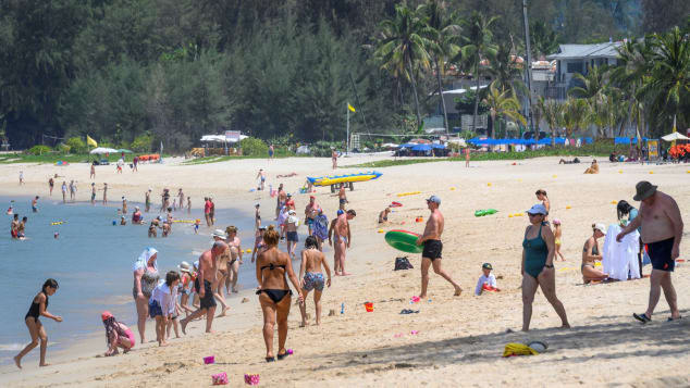 International tourists enjoy a Phuket beach in March, just weeks before the island locked down due to Covid-19.  