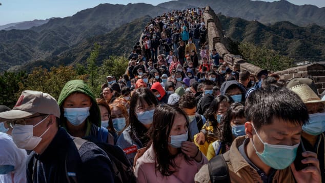 Chinese tourists crowd a bottleneck as they move slowly along the Great Wall of China during the Golden Week holiday in October, 2020.