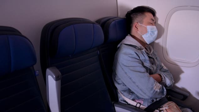 Wear a mask that covers your mouth and nose throughout your flight and stay seated as much as possible.